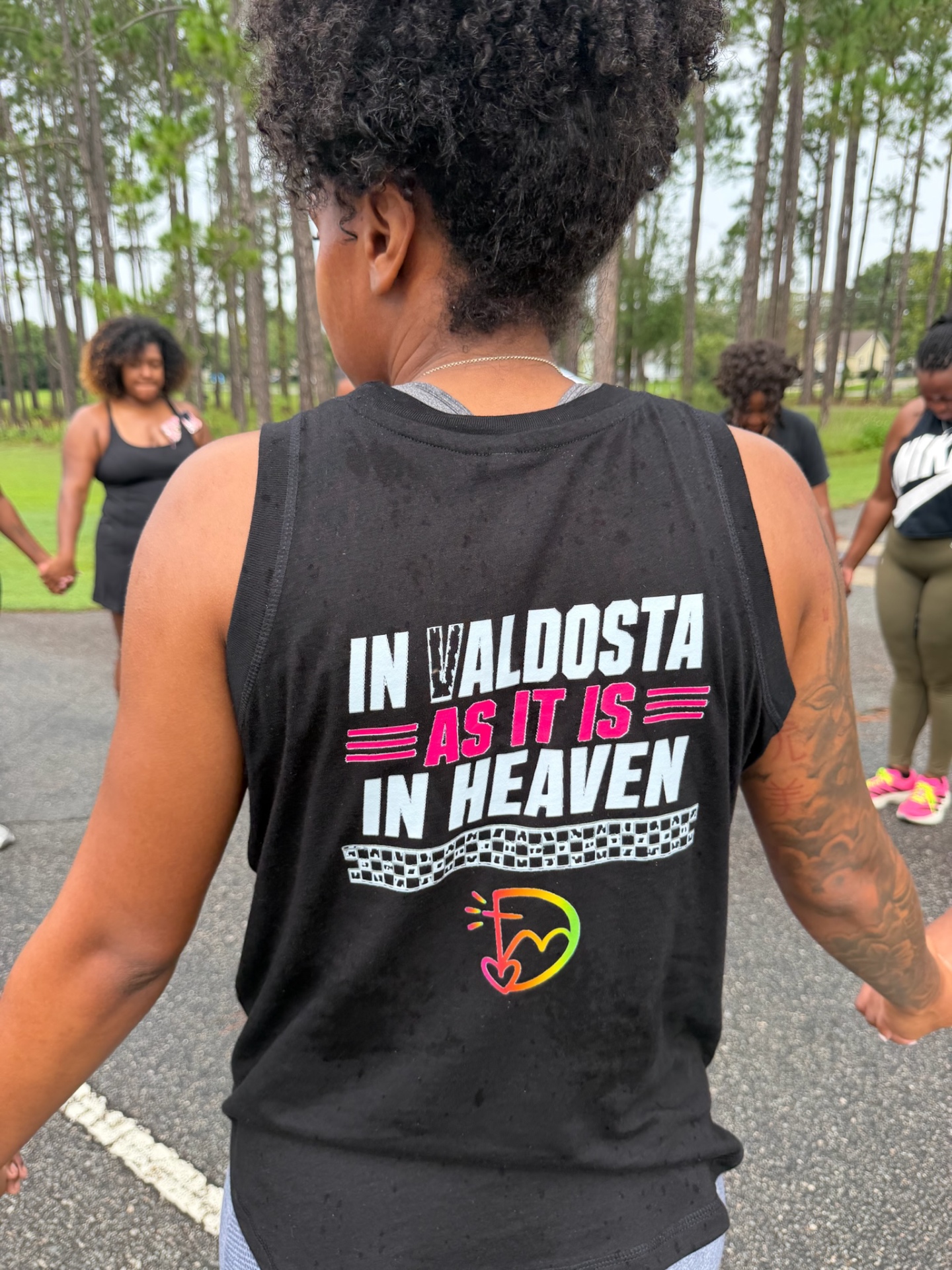 Black DEM tank top with In Valdosta As It Is In Heaven print and neon logo